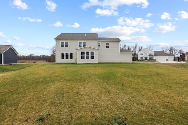 rear view of house with a yard