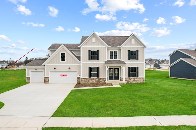 view of front of house featuring a garage and a front lawn