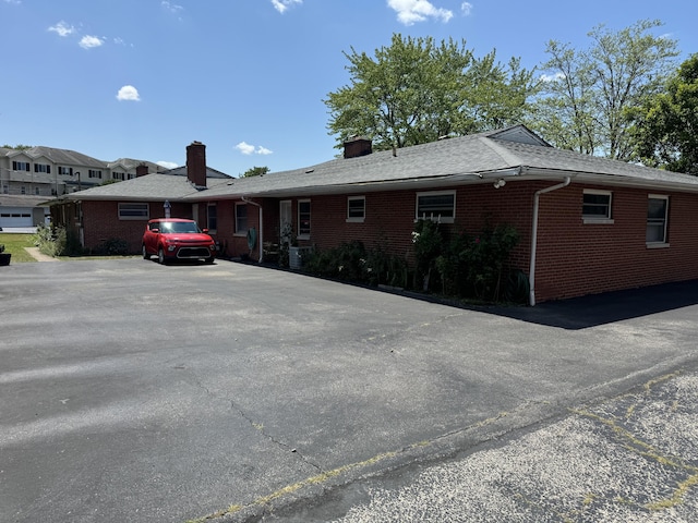 1763-1769 Ardleigh Rd Unit 1763-1769, Upper Arlington, OH 43221 - view of front facade with brick siding and a chimney
