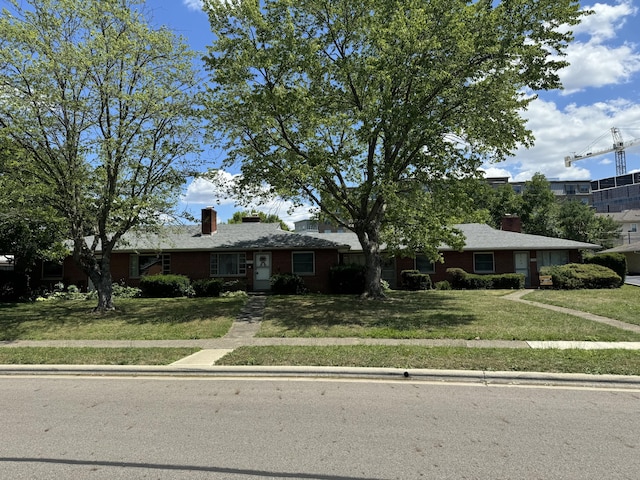 ranch-style home with a front yard