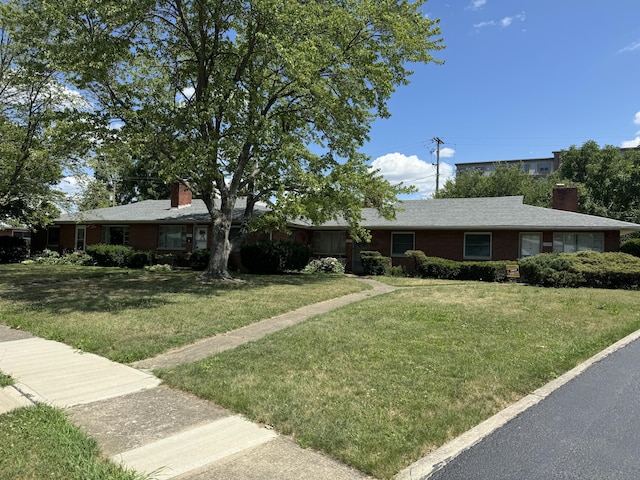 1763-1769 Ardleigh Rd Unit 1763-1769, Upper Arlington, OH 43221 - ranch-style house featuring a chimney, a front yard, and brick siding