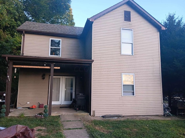 rear view of house with french doors and a patio