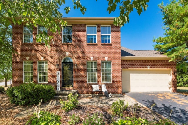 colonial home featuring a garage