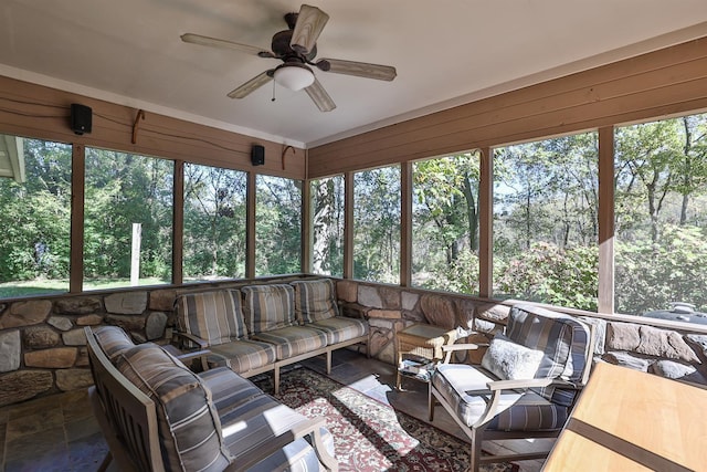 sunroom with plenty of natural light and ceiling fan