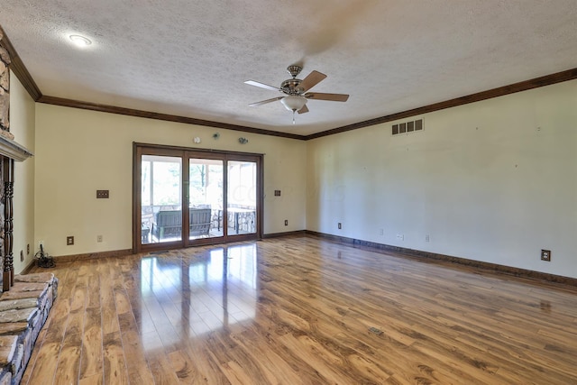 unfurnished living room featuring ceiling fan, crown molding, a textured ceiling, and hardwood / wood-style flooring