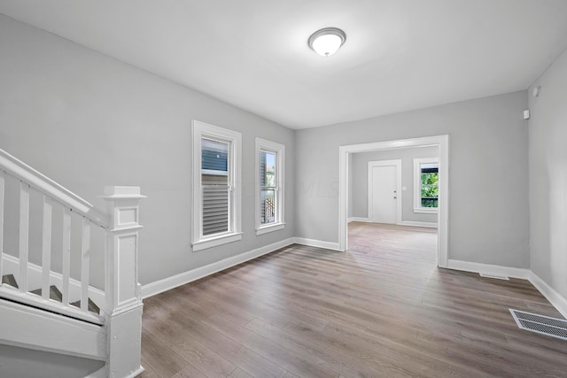 unfurnished room featuring hardwood / wood-style floors