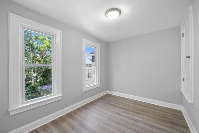 empty room with light hardwood / wood-style floors