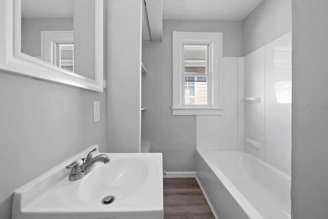 bathroom featuring hardwood / wood-style flooring and sink