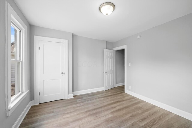 unfurnished bedroom with light hardwood / wood-style flooring