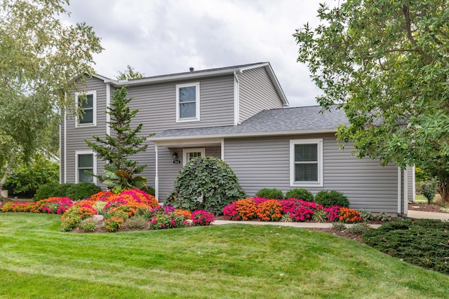 view of front of property with a front lawn