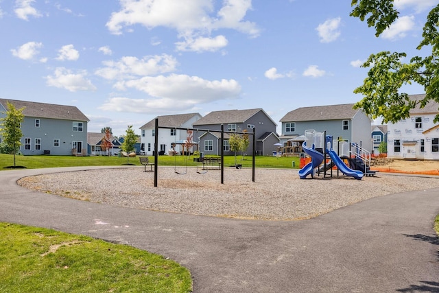 community play area with a residential view and a yard