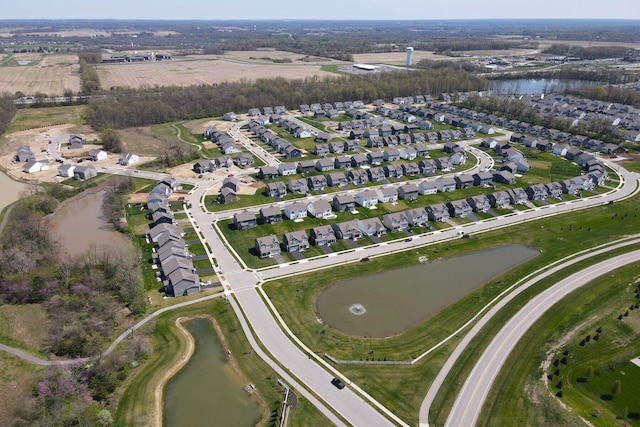 bird's eye view featuring a residential view and a water view