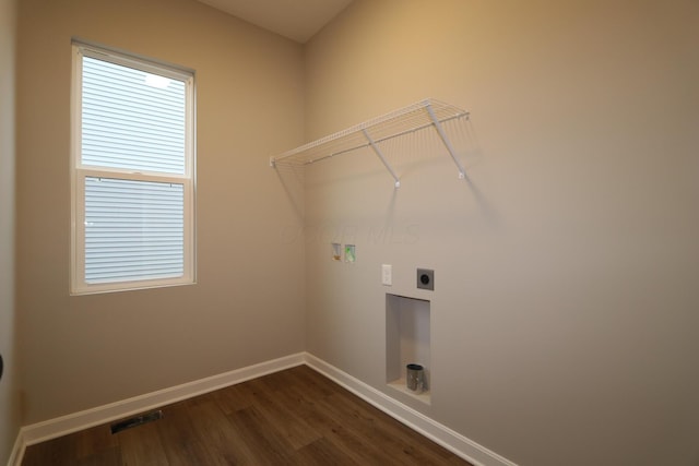 clothes washing area with washer hookup, dark wood-type flooring, and hookup for an electric dryer