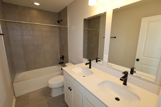 full bath featuring washtub / shower combination, tile patterned flooring, a sink, and toilet