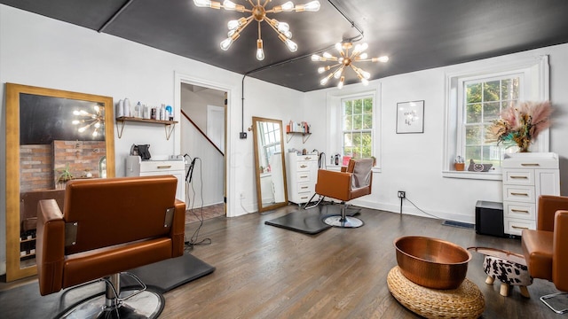 interior space with wood-type flooring and an inviting chandelier