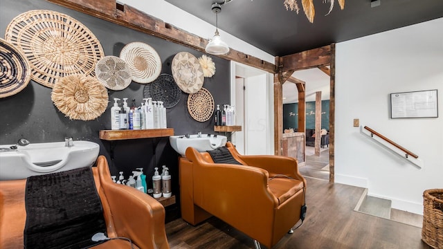 interior space with hardwood / wood-style floors and sink