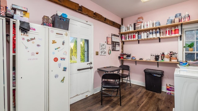 interior space featuring washer / clothes dryer and dark wood-type flooring