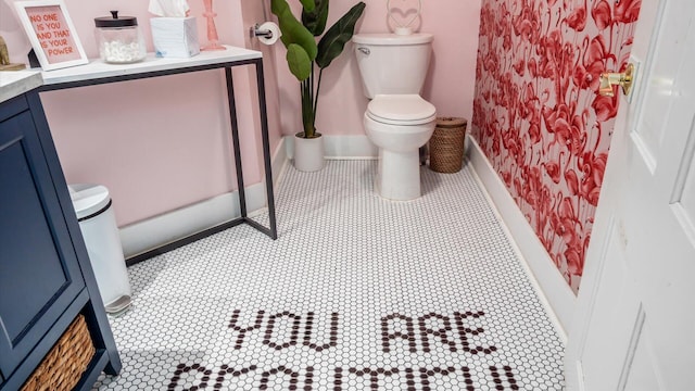 bathroom featuring vanity and toilet