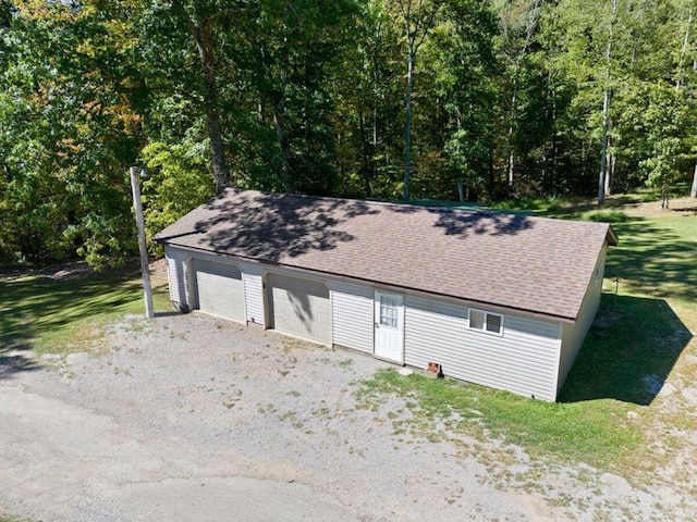 garage with a lawn