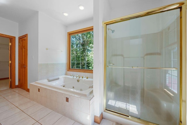 bathroom featuring separate shower and tub and tile patterned flooring