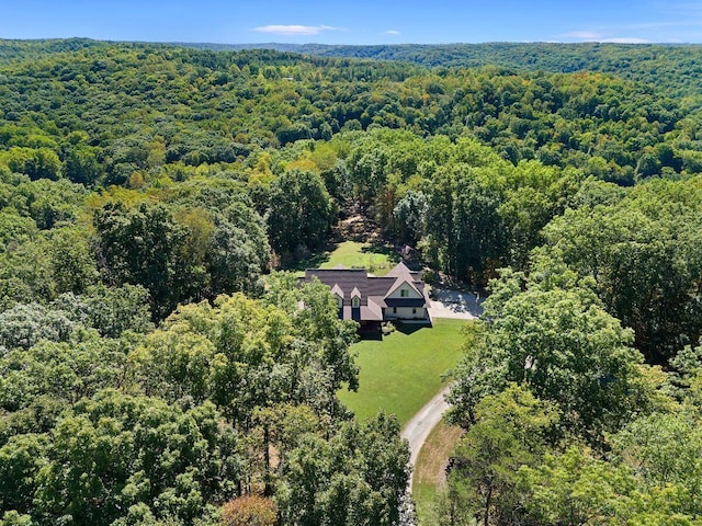 birds eye view of property with a forest view