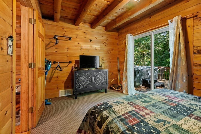 bedroom featuring wooden walls, visible vents, wooden ceiling, carpet, and beam ceiling