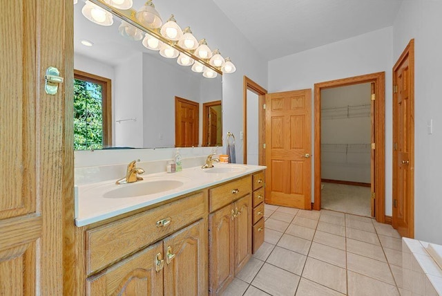 full bathroom with tile patterned flooring, a closet, a sink, and double vanity