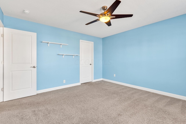 unfurnished bedroom featuring ceiling fan, a closet, and carpet floors