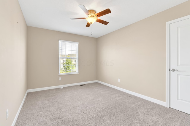 unfurnished room with carpet flooring and ceiling fan