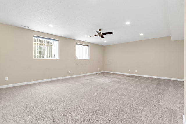 unfurnished room featuring carpet flooring and ceiling fan