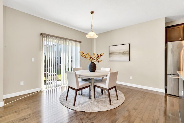 dining area with light hardwood / wood-style flooring