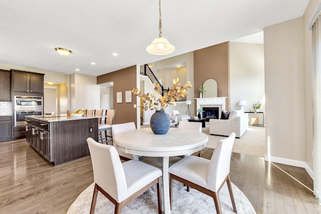 dining room featuring light wood-type flooring