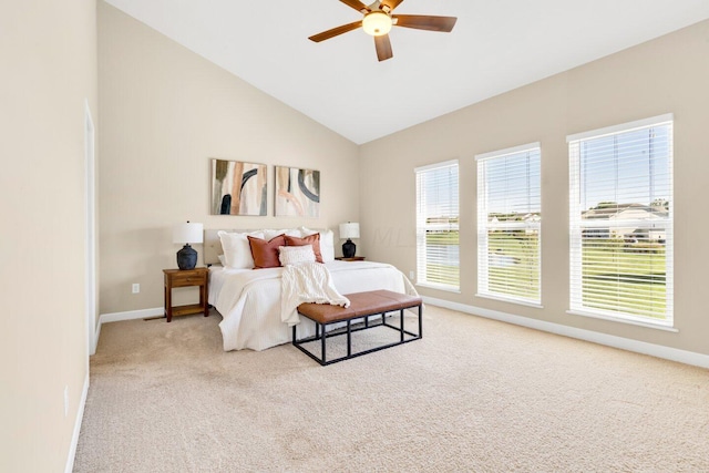 bedroom featuring ceiling fan, light carpet, and vaulted ceiling