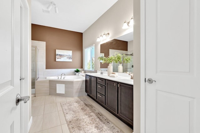 bathroom featuring separate shower and tub, tile patterned flooring, and vanity