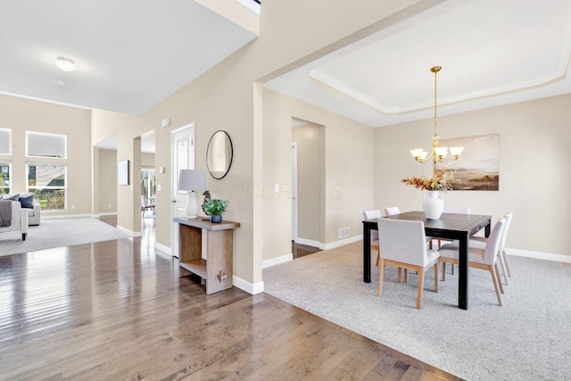 2353 Killdeer Pl, Galena, OH 43021 - dining space featuring wood finished floors, a chandelier, and a raised ceiling