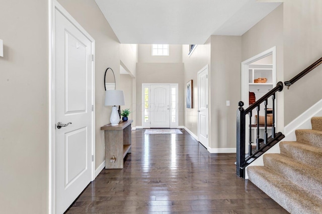 foyer entrance featuring dark hardwood / wood-style floors