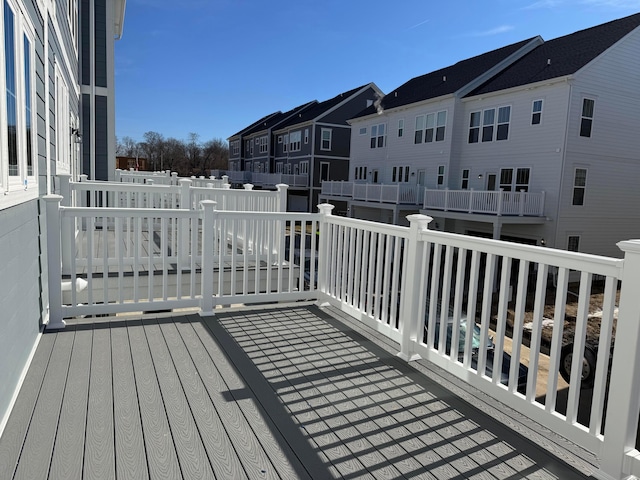 wooden deck featuring a residential view