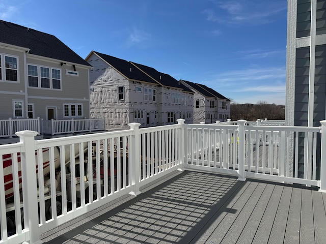 wooden deck featuring a residential view