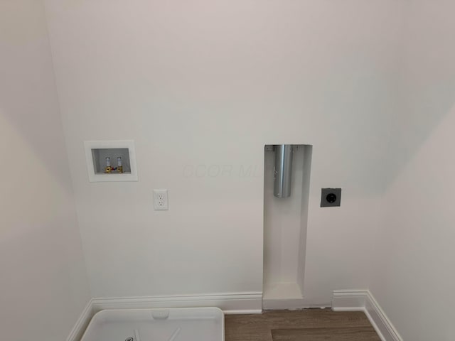 clothes washing area featuring hookup for a washing machine, laundry area, hookup for an electric dryer, and baseboards