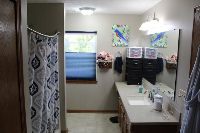 bathroom with a shower with curtain and vanity