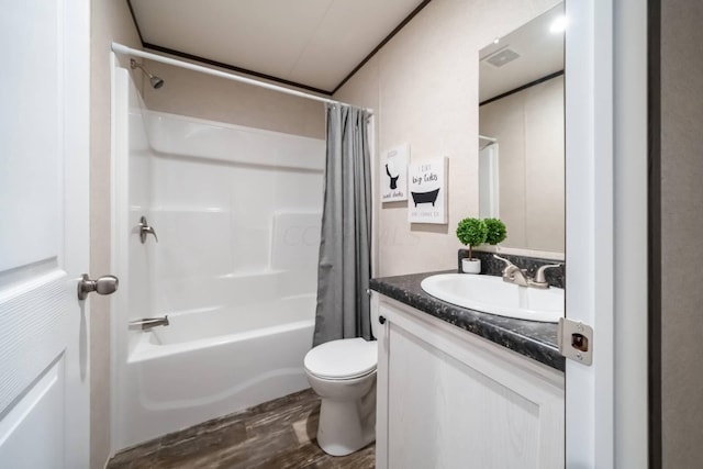 full bathroom with hardwood / wood-style floors, vanity, toilet, and shower / bathtub combination with curtain