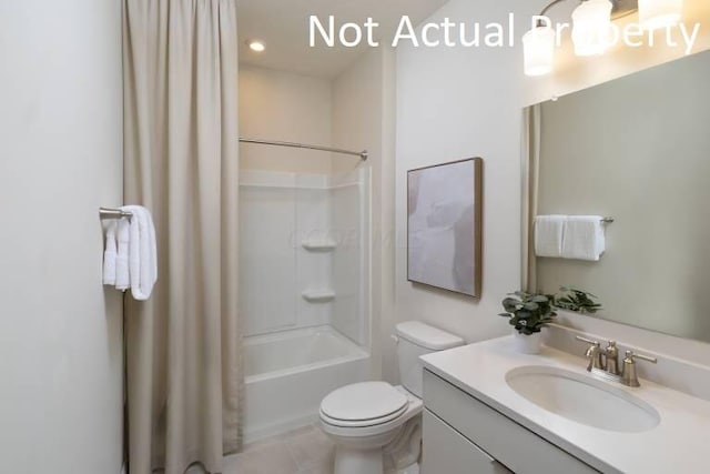 full bathroom featuring toilet, tile patterned floors, vanity, and shower / tub combo with curtain