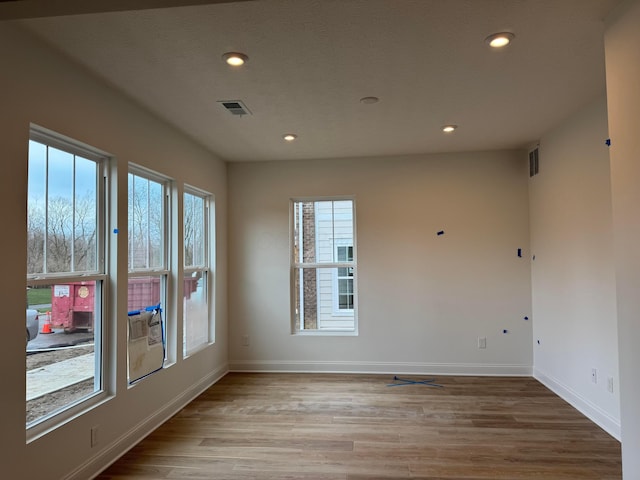 empty room with light wood-type flooring