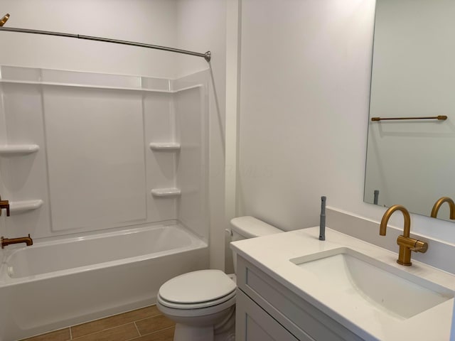 full bathroom featuring vanity, bathing tub / shower combination, and toilet