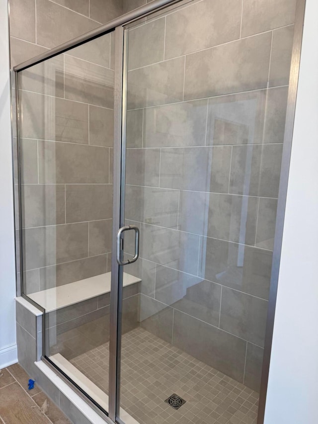 bathroom featuring an enclosed shower