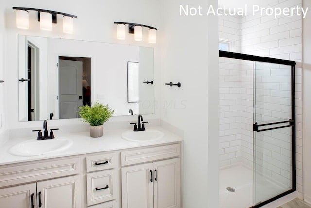 bathroom with vanity and an enclosed shower