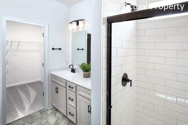 bathroom featuring vanity and an enclosed shower