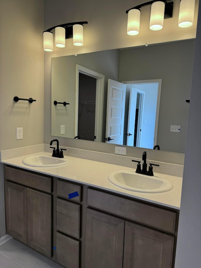 full bath featuring double vanity and a sink