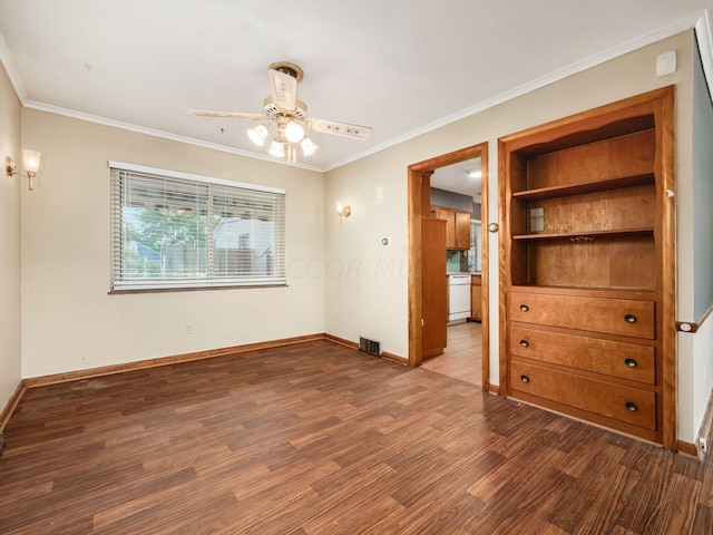 spare room with crown molding, dark hardwood / wood-style flooring, and ceiling fan