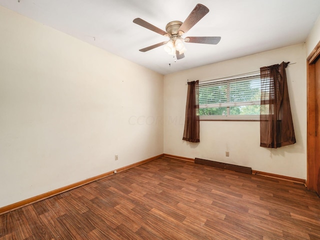 unfurnished room featuring ceiling fan, wood-type flooring, and baseboard heating